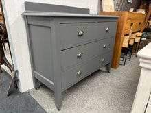 Load image into Gallery viewer, This beautiful wooden chest of drawers is finished in a vibrant &#39;Graphite&#39; shade that really stands out. It features two smaller dovetail-jointed drawers above two larger ones, offering plenty of storage space. Although it’s pre-owned and shows some minor marks, they don’t detract from its charm.

Overall Dimensions

103cm wide x 46.5cm deep x 80cm high / 90cm high to backboard

DELIVERY AVAILABLE      

For our other items see our website https://fossewayfurniture.co.uk

collection from our shop at cv36, o

