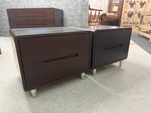 Load image into Gallery viewer, A stylish pair of modern brown bedside tables, both in excellent structural condition with only minor cosmetic marks. Each unit features two practical short drawers, offering convenient storage for bedside essentials. Perfect for completing a contemporary bedroom scheme.

Delivery Available

Overall Dimensions

52cm wide x 42cm deep x 42cm high&nbsp;


