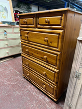 Load image into Gallery viewer, A charming solid pine chest of drawers that combines practicality with timeless appeal. This well-built piece features two compact drawers positioned above four spacious ones, offering versatile storage solutions for any room. Despite its pre-loved status, it remains in excellent working order with only minor cosmetic marks that add character rather than detract from its functionality.

Delivery Available

Overall Dimensions

77cm wide x 40cm deep x 107cm high&nbsp; &nbsp;

