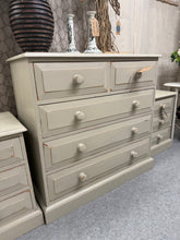 Load image into Gallery viewer, A charming solid pine chest of drawers with a soft greige finish and subtle distressed detailing. Features two short dovetail-jointed drawers above three spacious long drawers, offering generous storage for any bedroom. Structurally sound and in excellent condition, this piece combines practical functionality with vintage character.

Delivery Available

Overall Dimensions

91.5cm wide x 45cm deep x 88.5cm high

