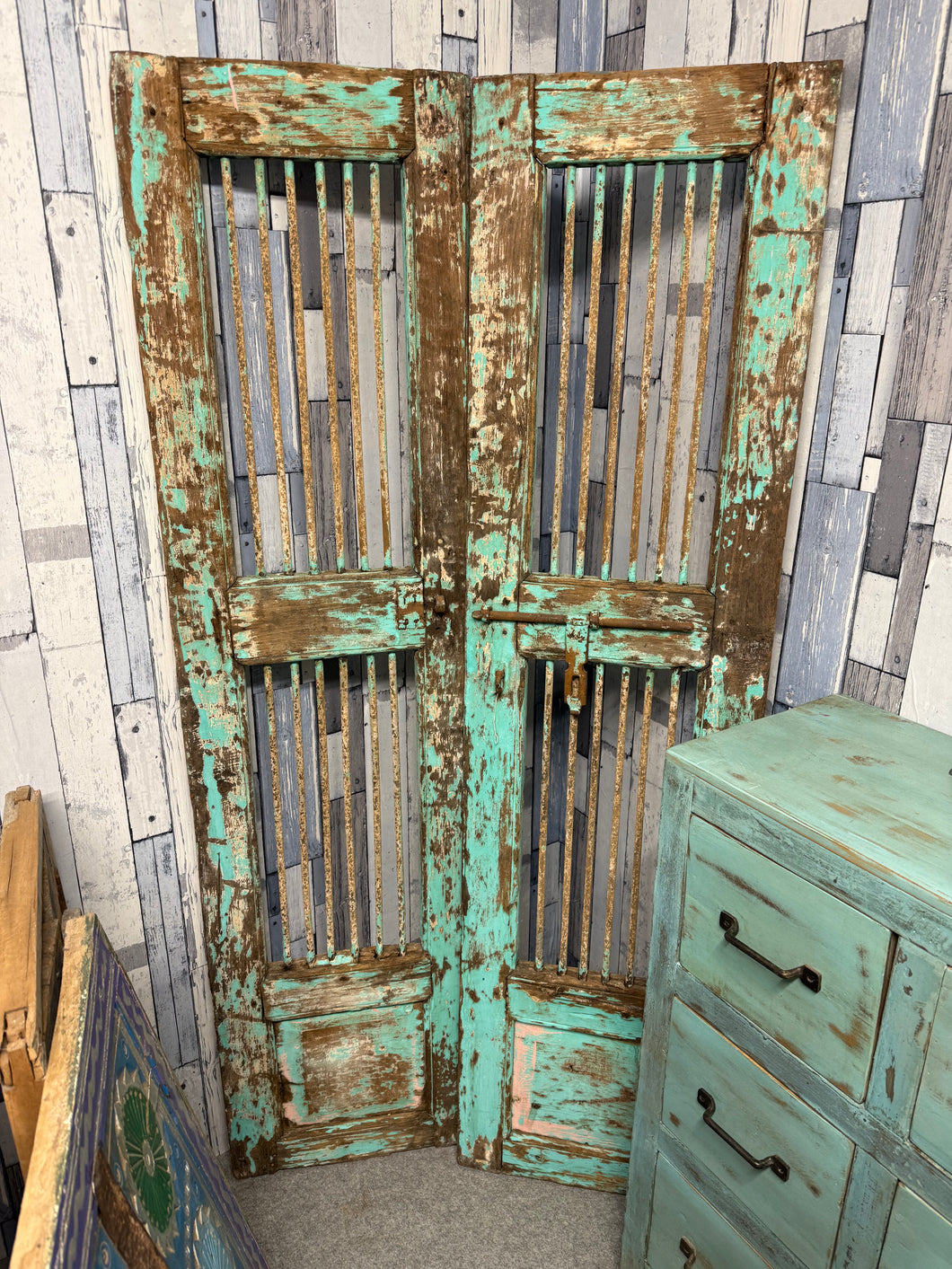 Bring vibrant character to any space with these exquisite turquoise jali doors imported directly from India. Crafted with solid construction they're wonderfully versatile—use them to create striking room divisions indoors or add an exotic touch to your garden entrance. These authentic pieces combine timeless artistry with practical durability, transforming ordinary areas into something truly special.

Overall Dimensions

Each Panel Measures : 43cm wide x 164cm high

DELIVERY AVAILABLE      

For our other i