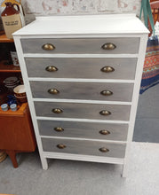 Load image into Gallery viewer, This striking two-tone mid-century chest of drawers combines timeless design with practical storage. Featuring six spacious dovetail-jointed drawers, it offers reliable organisation for any bedroom or living space. Structurally sound and in good overall condition, this vintage piece shows authentic character with minor wear consistent with its age. A versatile addition to mid-century modern interiors.

Delivery Available

Overall Dimensions

75.5cm wide x 41.5cm deep x 123cm high

