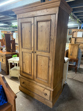 Load image into Gallery viewer, A versatile solid pine storage piece that works as a larder, linen press, or wardrobe with the addition of a hanging rail. Structurally sound and well-maintained, this cabinet features two internal shelves and a single dovetail-jointed drawer for organised storage. The finish shows minor cosmetic marks consistent with age, but nothing that detracts from its functionality or appeal. Disassembles into three sections for convenient transport and storage.

Delivery Available

Overall Dimensions

114cm wide x 65
