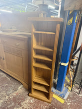 Load image into Gallery viewer, A narrow oak bookcase with six shelves, perfect for displaying books and décor in tight spaces. Structurally sound with minor cosmetic marks that add character. Ideal for bedrooms, home offices, or living areas where floor space is limited.

Delivery Available

Overall Dimensions

36cm wide x 20cm deep x 115cm high
