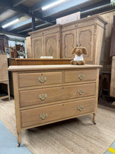 Load image into Gallery viewer, A beautiful satinwood chest of drawers, stripped to reveal its natural wood grain and warm patina. Structurally sound with excellent joinery, this piece features two short dovetail-jointed drawers above two generous long drawers. Mounted on smooth-rolling castors for effortless repositioning. The bare wood finish offers character and authenticity—a light coat of wax will enhance protection and bring out the wood's lustre.&nbsp;

Delivery Available

Overall Dimensions

107cm wide x 41cm deep x 80cm high


