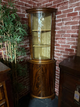 Load image into Gallery viewer, This handsome mahogany corner unit showcases classic period styling with practical storage across four shelves—two positioned in the upper section and two in the lower. The piece displays light surface marks consistent with age and use. A distinguished addition to any room seeking traditional charm and functional display space.

Delivery Available

Overall Dimensions

approx : 60cm wide x 170cm high
