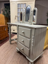 Load image into Gallery viewer, A charming vintage pine dressing table with matching mirror, painted in soft sage green. Features three practical drawers for jewellery, cosmetics, and accessories. The mirror sits freely, so you can reposition or remove it as needed. Original finish shows character and patina typical of pre-loved pieces—perfect for those who appreciate authentic vintage appeal. Structurally sound and ready to enhance any bedroom or dressing room with understated elegance.

Delivery Available

Overall Dimensions

table meas
