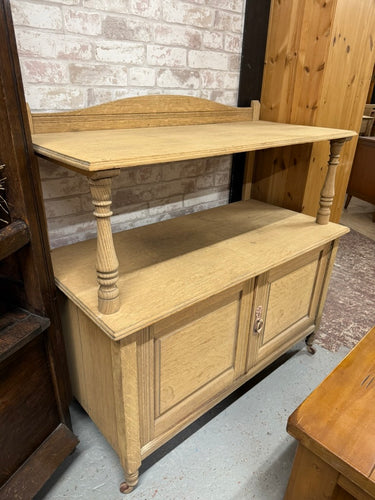 This delightful oak buffet has been carefully stripped back to reveal its natural finish, allowing the rich grain of the wood to shine through. Ideal for adding a warm, rustic touch to any room, it features one spacious shelf above a double cupboard, providing ample storage for your essentials. To keep it looking its best, a coat of wax is recommended for protection and to enhance its natural charm. Perfect for those who love timeless, natural furniture with practical storage options.

Overall Dimensions

1