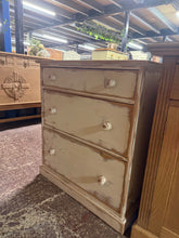 Load image into Gallery viewer, A charming pine chest of drawers with timeless appeal. Hand-painted in crisp white with an aged finish, featuring a naturally sanded top and distressed body. Three spacious drawers provide practical storage for bedroom essentials. Structurally sound and well-maintained, this piece brings vintage character to any room.

Delivery Available

Overall Dimensions

78.5cm wide x 50cm deep x 86cm high

