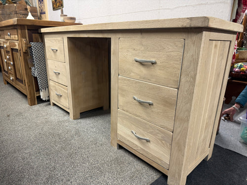 A versatile solid oak desk waiting for your personal touch. With six beautifully crafted dovetail-jointed drawers, you'll enjoy generous storage for all your essentials. The freshly sanded surface is primed and ready for your choice of wax finish or paint, allowing you to customise it to match your space perfectly. Structurally robust and in overall good condition, this piece combines practical functionality with the timeless appeal of natural oak.

Delivery Available

Overall Dimensions

160cm wide x 42cm 