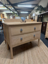 Load image into Gallery viewer, Discover the natural beauty of this stripped oak chest of drawers, restored to its authentic raw finish. Featuring robust dovetail-jointed drawers for reliable storage, it's an ideal choice for a bathroom vanity or bedroom furniture piece. A protective coat of wax will enhance the wood grain and ensure lasting durability.

Delivery Available

Overall Dimensions

92cm wide x 43cm deep x 77cm + 9cm high

