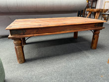 Load image into Gallery viewer, This hardwood coffee table combines durability with timeless style, making it a charming addition to any living space. Built to last, it remains sturdy and well-maintained despite gentle use. While it shows some minor marks, these do not detract from its overall appeal and character. Perfect for enjoying your morning coffee or gathering with friends, this table offers both function and warmth to your home.

Delivery Available

Overall Dimensions

110cm wide x 60cm deep x 39.5cm high

