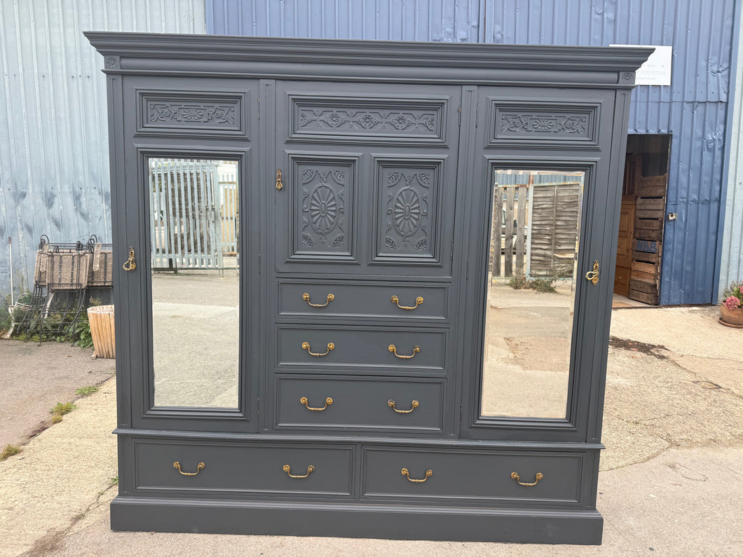 This beautiful large compactum wardrobe is finished in a stylish ash black paint. It’s pre-owned with only a few minor marks, nothing significant. This eye-catching piece is sure to be the talking piece of your room. Offering plenty of storage, it features five dovetail-jointed drawers, a cupboard with a hanging rail and hooks, another cupboard with three makeshift shelves, and a smaller cupboard with an additional shelf. For easy relocation, it breaks down into five parts.

Overall Dimensions

224cm wide x