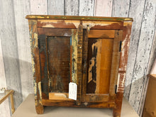 Load image into Gallery viewer, This charming small cupboard made from reclaimed wood is sturdy and well-maintained. It features a minor chip on one corner, which doesn’t affect its overall appeal. Inside, you’ll find two shelves perfect for organising your items.

Delivery Available

Overall Dimensions

64cm wide x 30cm deep x 70cm high

