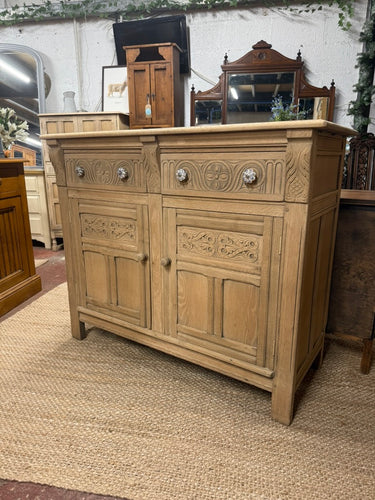 This beautiful solid oak sideboard has been fully stripped to reveal its natural, untouched finish and could be enhanced with a layer of wax for added protection. It features two dovetail jointed drawers above a double cupboard that includes a single shelf inside.

Overall Dimensions

122cm wide x 50cm deep x 101cm high

DELIVERY AVAILABLE      

For our other items see our website https://fossewayfurniture.co.uk

collection from our shop at cv36, our collection zone at bs36 or otherwise delivery is availab