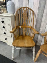 Load image into Gallery viewer, A charming vintage highback Windsor armchair with solid construction and authentic character. Previous owners have painted the legs white. Its timeless design brings warmth and elegance to country-style interiors, studies, or traditional living spaces. Well-preserved and ready to become a cherished focal point in your home.

Delivery Available

Overall Dimensions

approx : 63cm wide x 46.5cm deep x 117cm high

