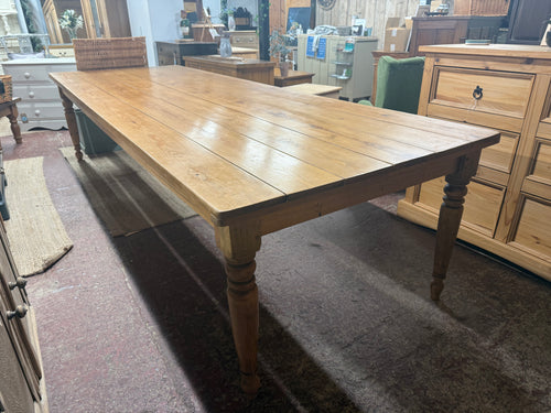 This stunning 11ft solid pine dining table combines durability with timeless style, making it a fantastic centerpiece for any dining room. Structurally sound and in overall great condition with only minor marks, it offers plenty of space to comfortably seat 12 people—or even more when needed—perfect for lively family gatherings and entertaining friends. Its sturdy, non-removable legs ensure a stable, reliable surface for meals, games, or celebrations. Bring warmth and character to your home with this spacio