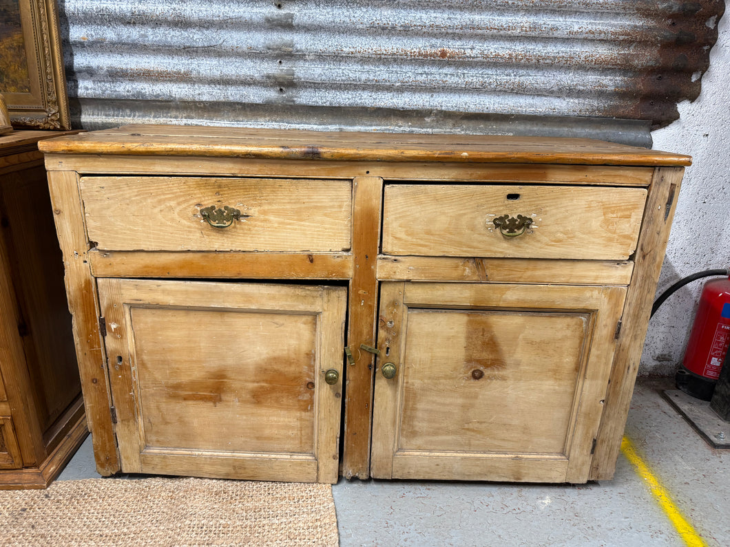 This exquisite antique pine sideboard is in good structural condition, with only minor issues due to its age. However, it may require some minor repairs, such as rehanging one of the doors and replacing a missing back panel, but these are not significant. It features 2 dovetail jointed drawers and a double cupboard with 1 long shelf.

Overall Dimensions

140cm wide x 52.5cm deep x 90cm high

DELIVERY AVAILABLE      

For our other items see our website https://fossewayfurniture.co.uk

collection from our sh