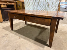 Load image into Gallery viewer, This solid hardwood coffee table brings practical storage to your living space with four generous drawers. While it shows honest signs of use—including a missing handle and light surface marks—the piece remains structurally robust and ready for everyday use. An ideal centrepiece for any lounge, it combines functionality and style.

Delivery Available

Overall Dimensions

110cm wide x 65cm deep x 48cm high&nbsp;

