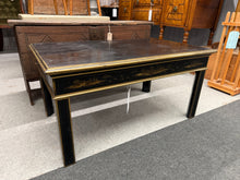 Load image into Gallery viewer, An exquisite Chinoiserie black lacquer coffee table that combines timeless elegance with practical functionality. This statement piece features authentic craftsmanship with a lustrous finish and intricate detailing. Structurally sound and well-maintained, it bears the gentle patina of age with only minor surface marks that enhance its vintage charm. Ideal for adding sophisticated character to any living room whilst providing a striking focal point for your interior décor.

Delivery Available

Overall Dimens
