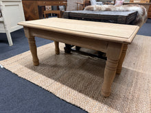 Load image into Gallery viewer, Crafted from solid oak and stripped to reveal its authentic grain, this coffee table showcases natural wood. The bare finish allows the wood's inherent beauty to shine through, though you may wish to apply wax or oil for added protection and longevity. A straightforward piece that celebrates honest craftsmanship and timeless design.

Delivery Available

Overall Dimensions

91cm wide x 45cm deep x 44cm high

