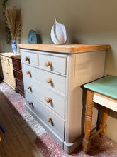 Load image into Gallery viewer, A characterful rustic mahogany chest of drawers with authentic vintage appeal. Featuring 2 short dovetail-jointed drawers over 3 long drawers, offering generous storage for bedrooms or living spaces. Hand-painted in Farrow &amp; Ball's 'London Stone' for a sophisticated, contemporary finish that complements period and modern interiors alike. Structurally sound with honest wear that adds to its charm—patina marks and minor veneer loss reflect its lived-in history and genuine heritage. An ideal statement piec
