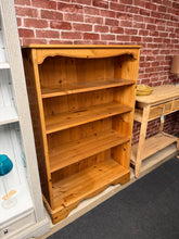 Load image into Gallery viewer, Crafted from pine, this versatile bookcase features three adjustable shelves to accommodate books, décor, and everyday essentials. The sturdy construction provides reliable storage for home offices, living rooms, or bedrooms. With its timeless natural finish, it complements various interior styles while offering practical organisation solutions for any space.

Delivery Available

Overall Dimensions

85cm wide x 29cm deep x 125cm high&nbsp;


