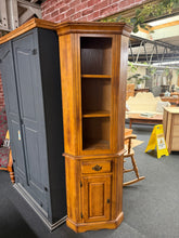Load image into Gallery viewer, A characterful heavy oak corner unit with solid construction and practical storage. Features two shelves in the upper section - small drawer, and a cupboard at the base—ideal for maximising corner space. Shows honest signs of use with minor marks consistent with age, adding to its authentic vintage appeal. Structurally sound and ready for a new home.

Delivery Available

Overall Dimensions

approx : 65cm wide x 29cm deep x 185cm high

