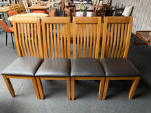 Load image into Gallery viewer, A charming set of four oak dining chairs, each structurally sound and ready for everyday use. These pre-loved pieces showcase the natural character of oak with minor surface marks that add to their authentic appeal. Ideal for completing a dining space with warmth and timeless style.

Delivery Available

Overall Dimensions

approx : 47cm wide x 46cm deep x 110cm high

