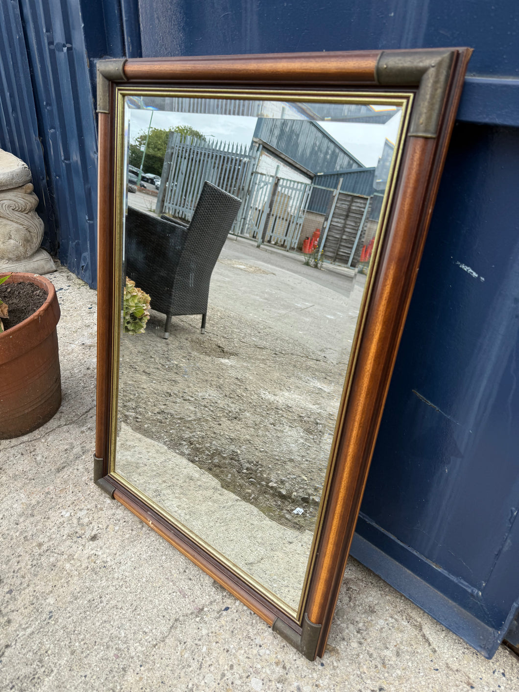This beautiful bevelled edged mirror features elegant brass corners. It is pre-owned and shows some minor marks, but nothing significant. A hanging wire is attached at the back, making it simple to mount.

Delivery Available

Overall Dimensions

59cm wide x 82cm high
