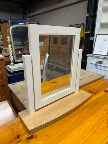 This beautiful two-tone dressing table mirror is sturdy and well-maintained. It would look fantastic placed atop a chest of drawers.

Delivery Available

Overall Dimensions

54cm wide x 16cm deep x 53cm high
