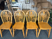 Load image into Gallery viewer, A delightful set of four pine wheelback chairs that combine timeless design with practical durability. Built to last, these dining chairs are structurally robust and maintain excellent condition throughout. Bearing the gentle patina of previous use, their minor imperfections only enhance their authentic character. Transform your dining room with these versatile, characterful pieces that promise years of enjoyment and conversation.

Overall Dimensions

approx : 38cm wide x 44cm deep x 91cm high

DELIVERY AVA
