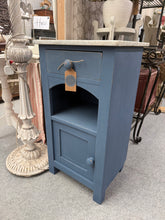 Load image into Gallery viewer, A charming blue painted pot cupboard with timeless appeal. Structurally sound and in excellent overall condition, this piece combines practicality with vintage character. Features a beautiful marble top, a dovetail jointed drawer for delicate items, and an enclosed cupboard providing discreet storage. Perfect for displaying treasured collectibles or storing tableware with style.

Delivery Available

Overall Dimensions

42.5cm wide x 38.5cm deep x 79cm high
