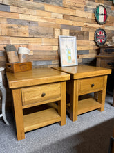 Load image into Gallery viewer, A handsome pair of substantial oak side tables, built to last. Each features a dovetail-jointed drawer and lower shelf for convenient storage. Solidly constructed with some minor marks. Ideal for those seeking robust, spacious bedside companions with genuine country appeal.

Delivery Available

Overall Dimensions

60cm wide x 60cm deep x 60cm high

