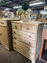Load image into Gallery viewer, A characterful solid pine chest with authentic stripped-back finish. Featuring two shallow drawers above four generous storage drawers, this piece offers practical storage with traditional appeal. The natural wood showcases beautiful grain patterns and patina. Structurally sound and ready for use—a light wax coat will enhance protection and bring out the wood's warmth. Perfect for bedrooms, hallways, or living spaces seeking vintage charm with real substance.

Delivery Available

Overall Dimensions

75cm wi
