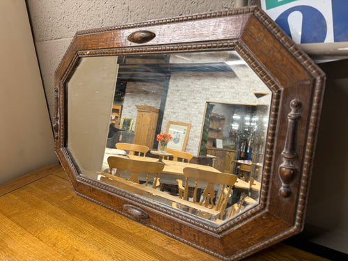 This beautiful oak framed mirror features a beveled edge and is solidly built. While it is pre-owned and shows some minor marks, these do not detract from its charm. It comes with a long hanging chain for easy display.

Delivery Available

Overall Dimensions

68cm wide x 45cm high   
