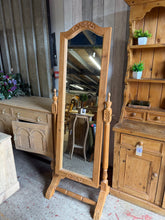 Load image into Gallery viewer, A charming freestanding pine mirror that combines practicality with character. Structurally sound and in good condition, it bears gentle signs of age that add to its authentic appeal. The removable mirror lifts easily from the frame, making relocation and cleaning effortless. A versatile piece for any room.

Delivery Available

Overall Dimensions

62cm wide x 47cm deep x 176cm high

