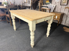 Load image into Gallery viewer, Welcome six guests around this beautiful solid pine dining table, featuring elegantly distressed off-white legs that showcase genuine rustic character. The subtle surface marks tell a story of timeless appeal, while the practical front drawer keeps your dining essentials within easy reach. Perfect for creating memorable meals and moments with loved ones, this piece brings both style and functionality to your home.

Overall Dimensions

121.5cm long x 81cm wide x 77cm high

DELIVERY AVAILABLE      

For our o
