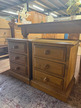 Load image into Gallery viewer, This charming pair of vintage pine bedsides combines timeless character with practical storage. Each unit features three dovetail-jointed drawers, offering ample space for bedside essentials. Structurally sound and in good overall condition, they bear the gentle patina of age—subtle marks that add authentic vintage appeal rather than detract from their appeal. Perfect for those seeking genuine period pieces with both style and function.

Delivery Available

Overall Dimensions

44.5cm wide x 36.5cm deep x 56
