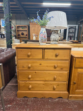 Load image into Gallery viewer, A charming solid pine chest of drawers built to last. Featuring dovetail-jointed construction with practical storage across five drawers—two shallow and three deep—this piece offers ample space for bedroom essentials or living room storage. Structurally sound with character marks that add to its authentic appeal. Perfect for those seeking quality wooden furniture with genuine craftsmanship.

Delivery Available

Overall Dimensions

87cm wide x 40.5cm deep x 87.5cm high

