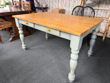 Load image into Gallery viewer, A practical pine kitchen table with timeless appeal. Structurally sound and ready for everyday use, it seats six comfortably and features four convenient storage drawers. The removable legs make transport and rearrangement simple. Some minor wear marks reflect its character as a well-loved piece. Ideal for families seeking genuine, functional furniture with rustic charm.

Delivery Available

Overall Dimensions

137.5cm wide x 92cm deep x 75cm high

