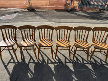 Load image into Gallery viewer, 
A charming set of 6 solid pine farmhouse chairs, structurally sound and ready for restoration. Each chair bears the character of age with surface marks and patina — ideal for upcycling enthusiasts or those seeking authentic vintage seating with DIY potential. Perfect for dining spaces, kitchens, or creative projects.

Delivery Available

Overall Dimensions

approx : 41cm wide x 41cm deep x 86cm high

