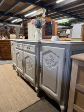 Load image into Gallery viewer, Distinctive Oriental sideboard finished in soft grey, combining vintage character with practical storage. Features two single cupboards, one double cupboard, and two spacious drawers—ideal for living rooms or hallways. As a pre-loved piece, it displays authentic patina and wear consistent with its age, adding to its unique charm. A striking focal point for those who appreciate curated, eclectic furnishings.

Delivery Available

Overall Dimensions

200cm wide x 56.5cm deep x 95cm high

