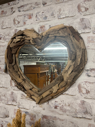 This charming driftwood heart mirror is sturdy and well-maintained. Its robust, rustic frame will bring a warm and welcoming touch to any room.

Delivery Available

Overall Dimensions

approx : 60c wide x 55cm high     
