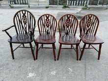 Load image into Gallery viewer, These well-built wheel-back dining chairs are in excellent condition and boast a striking wooden design. Though they may have minor marks, they are fully functional. The set includes 3 upright chairs and 1 carver chair.

Overall Dimensions

approx : 41cm wide x 48cm deep x 89cm high

DELIVERY AVAILABLE      

For our other items see our website https://fossewayfurniture.co.uk

collection from our shop at cv36, our collection zone at bs36

