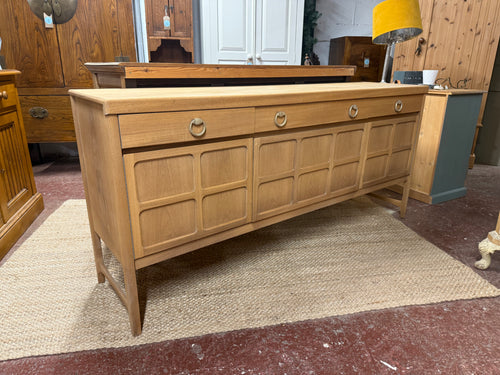 This cheerful teak sideboard has been beautifully restored to showcase its natural wood grain, ready for a simple wax finish to preserve its charm. Featuring versatile storage options with its combination of one long drawer, one short drawer, plus double and single cupboard spaces to keep your belongings neatly organized.

Overall Dimensions

183cm wide x 45cm deep x 83.5cm high

DELIVERY AVAILABLE      

For our other items see our website https://fossewayfurniture.co.uk

collection from our shop at cv36, 