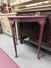 Load image into Gallery viewer, A striking wooden hall table finished in Farrow &amp; Ball's rich 'Brinjal' colour, featuring a subtle distressed finish that adds character and depth. Structurally robust and beautifully maintained, this piece commands attention in any entryway. Perfect as a focal point for displaying décor, keys, or welcoming guests with timeless style and sophisticated colour.

Delivery Available

Overall Dimensions

74cm wide x 37.5cm deep x 73.5cm high

