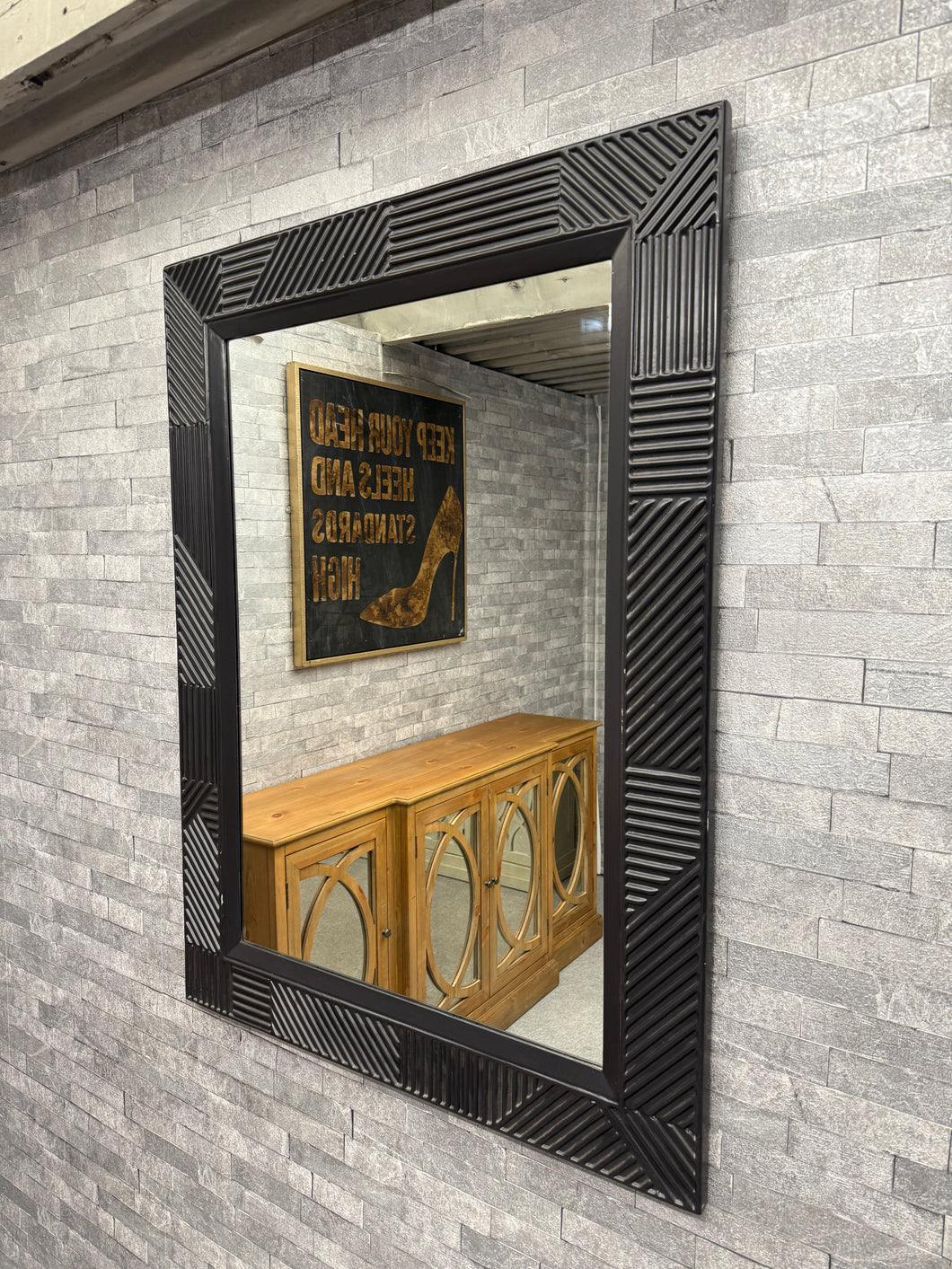 Discover the sophistication of this Art Deco mirror, a striking black-framed statement piece that brings vintage glamour to any interior. Minor imperfections at the corners are present but this does not affect its use. 

Delivery Available

Overall Dimensions

90cm x 120cm     
