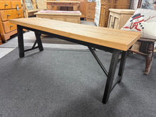 Load image into Gallery viewer, A sturdy dining bench combining industrial metal framework with a rustic wooden seat. Built to accommodate three diners comfortably. The solid construction ensures reliable everyday use, whilst the mixed-material design adds genuine vintage appeal to any dining space. Minor surface marks are present but nothing major at all.

Delivery Available

Overall Dimensions

140cm wide x 38cm deep x 49.5cm high

