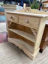 Load image into Gallery viewer, Solid pine bookcase in structurally sound condition with authentic character. Stripped back to reveal natural wood grain, with minimal white paint patina remaining. Features two dovetail-jointed drawers above a single shelf, offering practical storage for books and display items. A versatile piece that works beautifully in period or contemporary interiors.

Delivery Available

Overall Dimensions

86cm wide x 29cm deep x 91cm high&nbsp;

